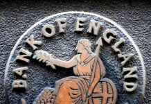 A plaque depicting Britannia is seen on the outside of the Bank of England in the City of London February 4, 2010. Britain's Bank of England put a hold on its unprecedented 200 billion pound asset-buying programme for the first time in 11 months on Thursday, but left the door open for more so-called quantitative easing if the economy relapsed. REUTERS/Toby Melville (BRITAIN - Tags: BUSINESS) - RTR29TSM