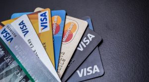 Visa CEO Plays Down Cryptocurrency Threat, Indicates Possible Intervention